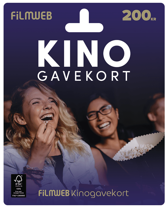 Personer som sitter i mørket i en kinosal og ser på film